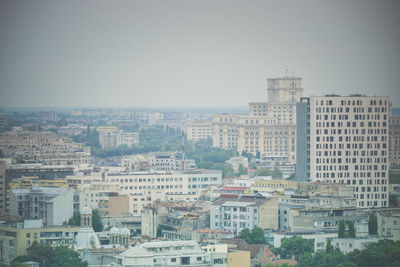 High angle view of buildings in city against sky