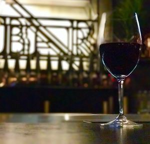 Close-up of wine in glass on table