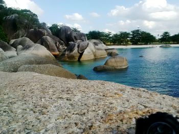 Scenic view of shore against sky