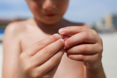 Close-up of man holding hands