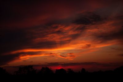 Scenic view of dramatic sky during sunset