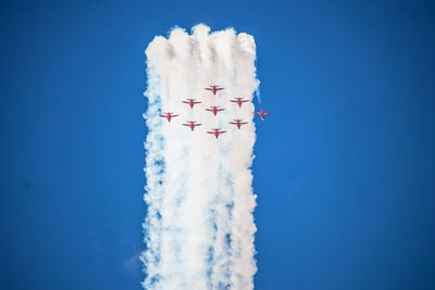 Low angle view of airplane flying in sky