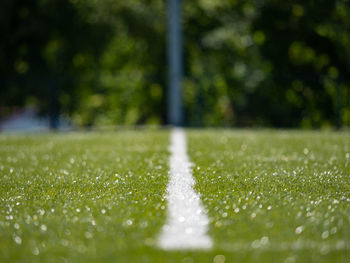 Lines on soccer football field, sport background. green artificial turf field with line boundary