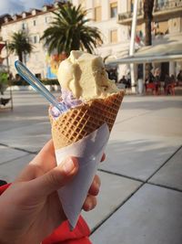 Cropped image of hand holding ice cream cone