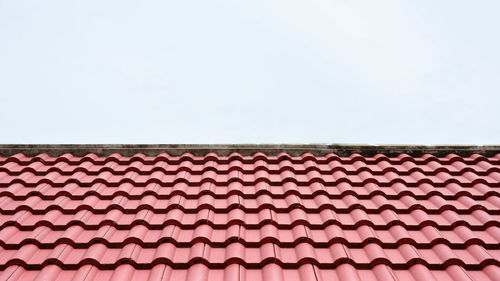 Low angle view of roof of building against clear sky