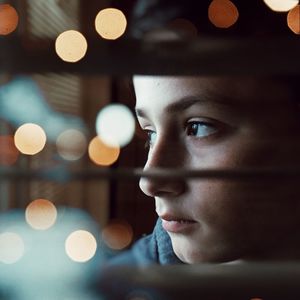 Close-up portrait of boy looking away