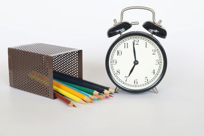 Close-up of clock on table