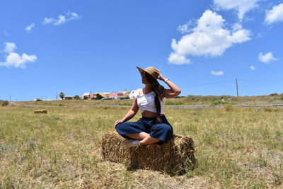 Woman sitting on field