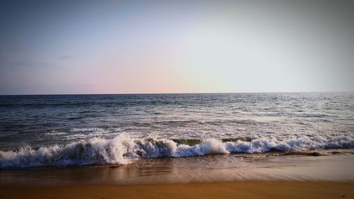 Scenic view of sea against clear sky during sunset