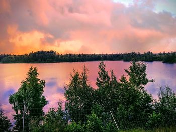 Scenic view of lake against sky during sunset