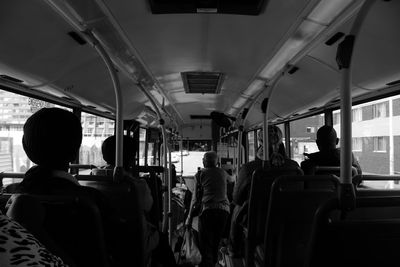 Rear view of people sitting in bus