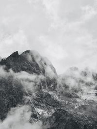 Low angle view of snowcapped mountains against sky - adamello and presanella alps