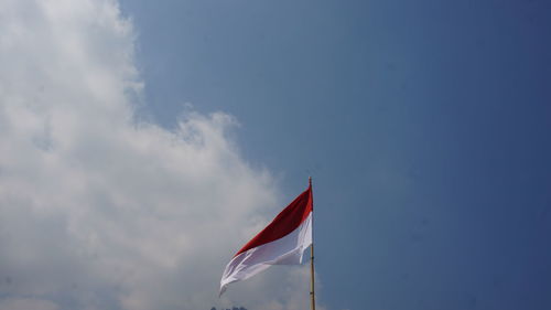 Low angle view of flag against sky