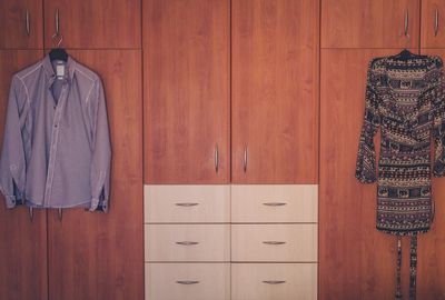 Clothes hanging on cabinets at home