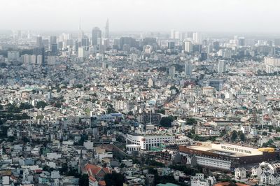 Aerial view of cityscape against sky