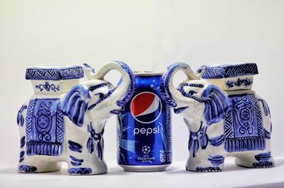 Close-up of objects on table against white background