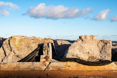 Rock formation against sky on sunny day