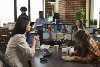 Businesswoman talking on video conference in office