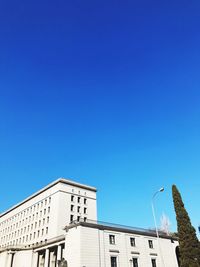 Low angle view of building against clear blue sky