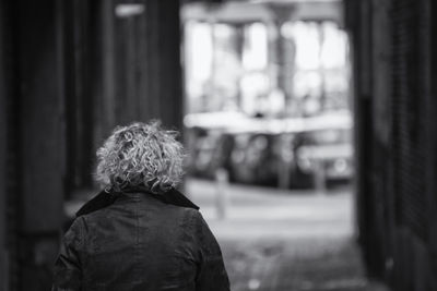 Rear view of woman against blurred background