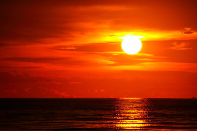 Scenic view of sea against romantic sky at sunset