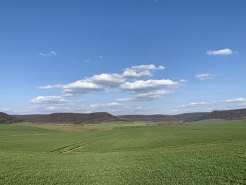 Scenic view of agricultural field against sky , in eichsfeld, thuringia, germany