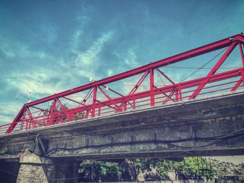 Low angle view of railway bridge against sky