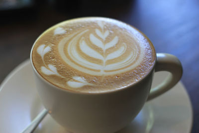 Close-up of cappuccino on table