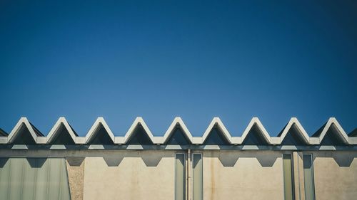 Low angle view of built structure against blue sky