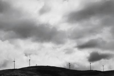 Low angle view of wind turbine against sky