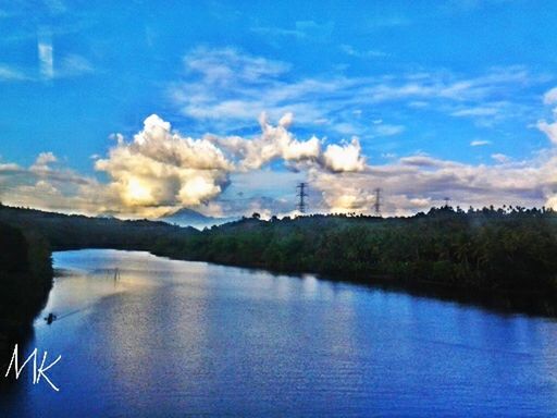 water, tranquility, tranquil scene, sky, waterfront, scenics, reflection, beauty in nature, lake, nature, cloud - sky, blue, tree, river, cloud, idyllic, calm, non-urban scene, outdoors, no people