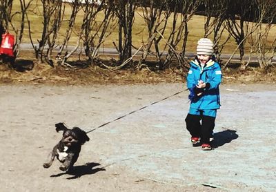 Full length of a man with dog