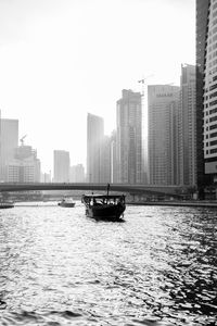 River in city against clear sky