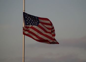 Low angle view of flag against the sky