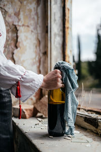 Midsection of woman holding drink