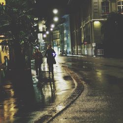 Full length of people in city at night