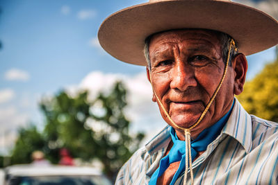 Portraits of an old man wearing hat culture and tradition 