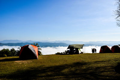 Tent on field against sky