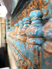 Close-up of rusty metal against wall