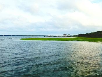 Scenic view of sea against cloudy sky