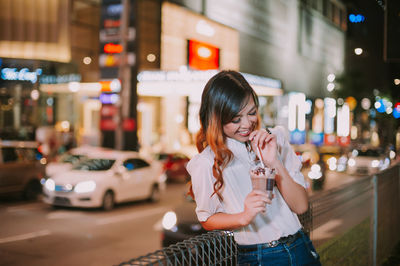 Full length of a beautiful young woman in city
