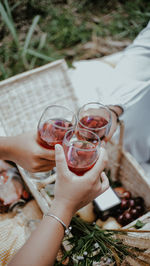 Midsection of woman drinking glass