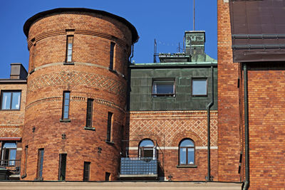 Low angle view of building against blue sky