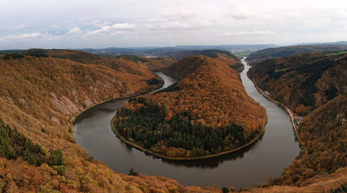 High angle view of river amidst landscape against sky