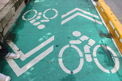 High angle view of arrow sign on road