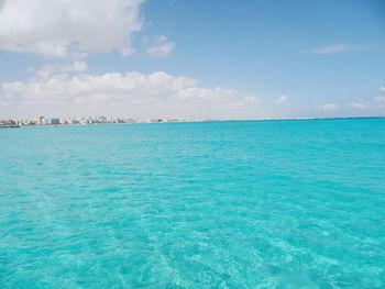 Scenic view of sea against cloudy sky