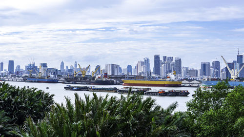 Scenic view of sea and buildings against sky