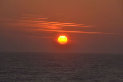 Scenic view of sea against romantic sky at sunset