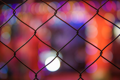 Full frame shot of chainlink fence against sky