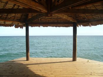 Pier over sea against sky